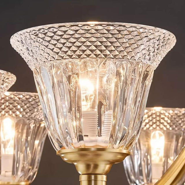 "Close-up of an intricate glass shade on an elegant chandelier, showcasing its texture and design."