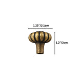 "Dimensions of a vintage brass flower-shaped knob with bold, rounded petals: 1.25 inches in diameter and 1.2 inches in height."