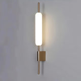 "Modern wall lamp with a cylindrical glass diffuser and iron frame, ideal for bathroom lighting."