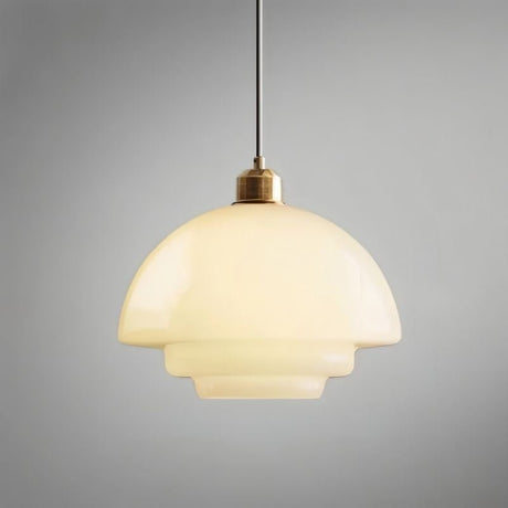 "A Niall pendant light with layered, rounded glass and metal finish, enhancing modern dining or living spaces."
