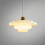 "Close-up of a single Niall pendant light with tiered design, crafted from durable metal and glass."