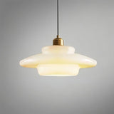 "Niall pendant light showcasing rounded edges, designed with metal and glass for contemporary settings."