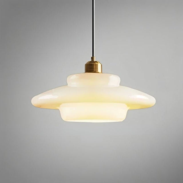 "Niall pendant light showcasing rounded edges, designed with metal and glass for contemporary settings."