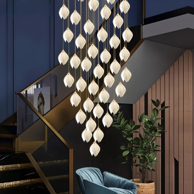 Nica Chandelier – Elegant Lighting for Modern Interiors featuring a grand multi-drop design with porcelain petals, perfect for staircases or foyers.