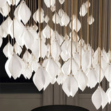 Nica Chandelier – Elegant Lighting for Modern Interiors with a dense cluster of porcelain petals, creating a dramatic lighting sculpture.