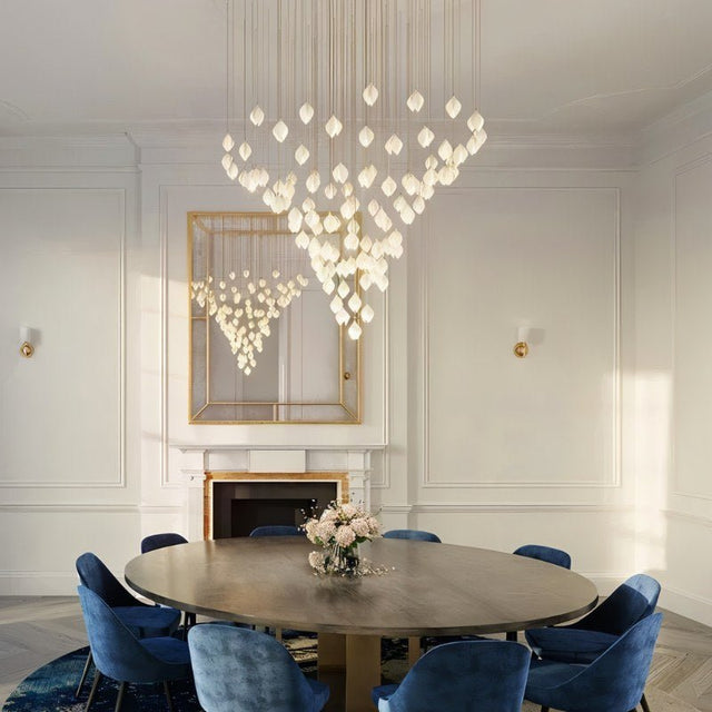Nica Chandelier – Elegant Lighting for Modern Interiors in a luxurious dining room with cascading porcelain pendants forming a sculptural centerpiece.