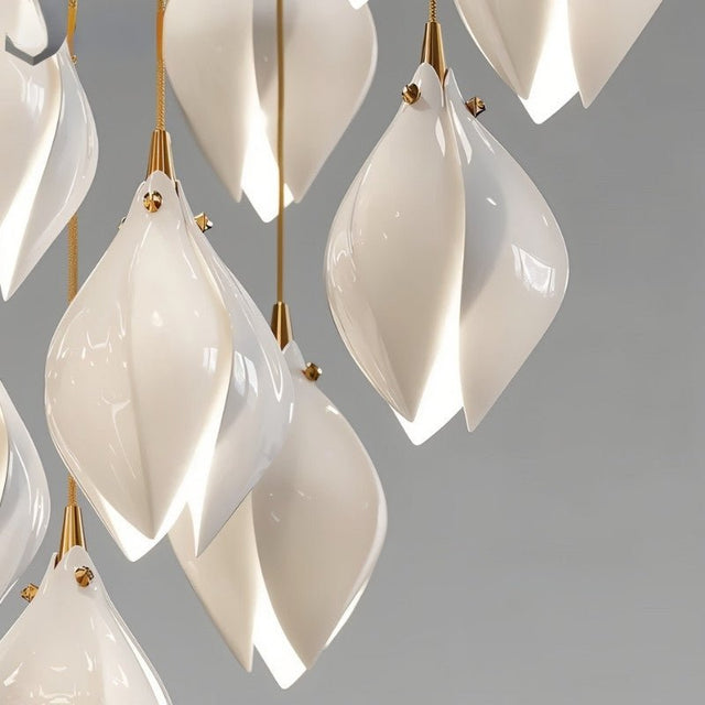 Nica Chandelier – Elegant Lighting for Modern Interiors close-up of glossy ceramic petals with gold fittings, showcasing craftsmanship and elegance.