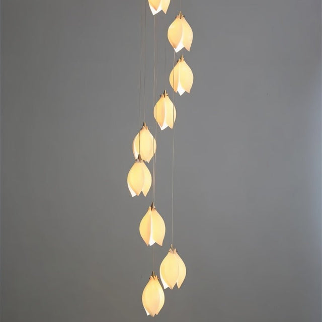 Nica Chandelier – Elegant Lighting for Modern Interiors with a vertical arrangement of ten warm-glow pendants, ideal for staircases or tall spaces.