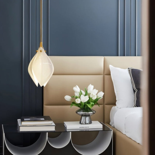 Nica Chandelier – Elegant Lighting for Modern Interiors with a single pendant beside a bed, offering soft ambient lighting for contemporary bedrooms.