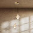 Nica Chandelier – Elegant Lighting for Modern Interiors with two petal-shaped porcelain lights suspended from a gold ceiling mount, ideal for hallways.