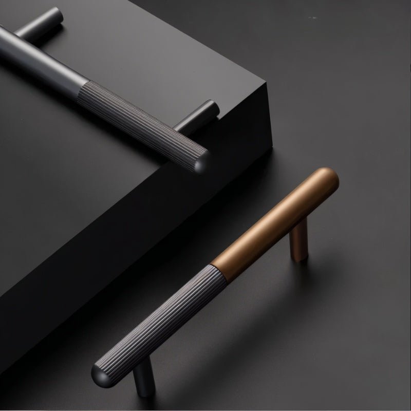 "Two minimalist aluminum knobs and pull bars with a sleek cylindrical design, showcasing their modern aesthetic."