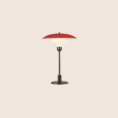 "Nisra Table Lamp with a red top shade and frosted glass diffuser, made from aluminum, iron, and glass, offering soft, ambient lighting in a modern design."