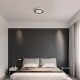 "The Nival ceiling light in a contemporary bedroom, featuring a sleek circular design with intricate accents, made from acrylic and aluminum for efficient and stylish lighting."