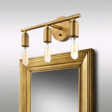 "Gold 3-light industrial wall sconce with a minimalist design above a matching gold-framed mirror."
