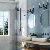 "Industrial wall sconce used as bathroom vanity lighting with two mirrors and a glass shower."