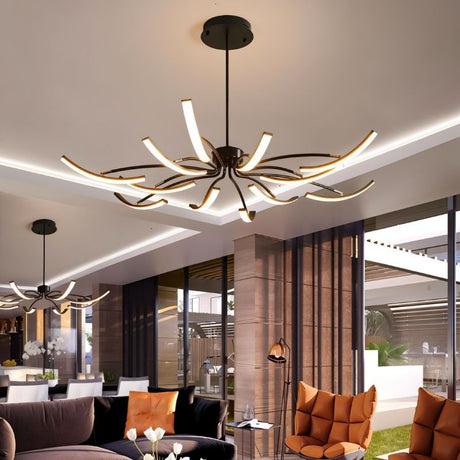 "A black chandelier with twelve curved branches, each tipped with a white light, installed in a large modern living room with a second matching chandelier visible in the background."