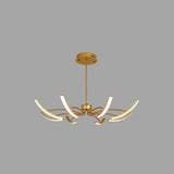 "A gold chandelier with six curved arms, each tipped with a white light, against a gray background."
