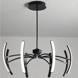 "A modern black chandelier with six curved arms, each tipped with a white light, installed on a white ceiling in a room."