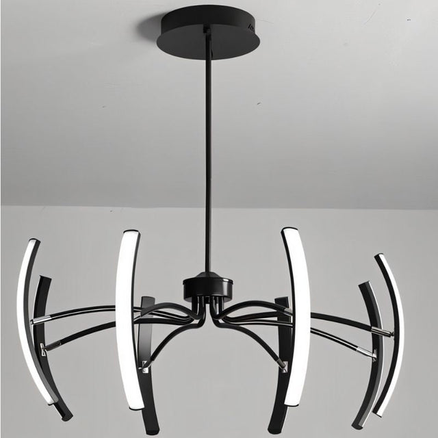 "A modern black chandelier with six curved arms, each tipped with a white light, installed on a white ceiling in a room."