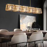 "Nyvora modern chandelier hanging above a dining room table."