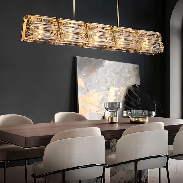 "Nyvora modern chandelier hanging above a dining room table."