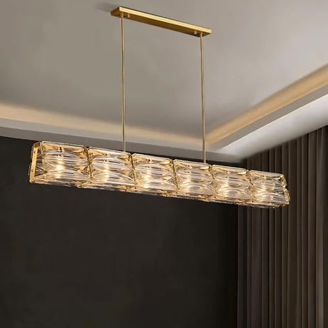"Modern glass pendant light with gold frame and geometric shades."