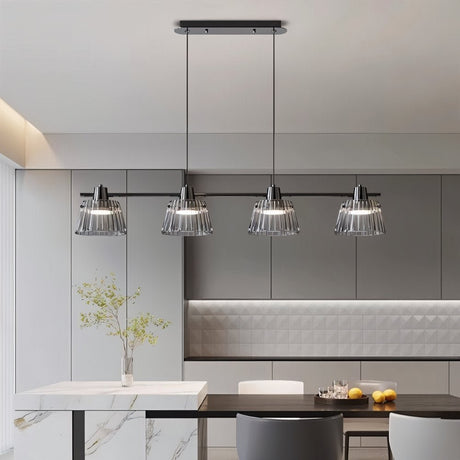 "Modern linear chandelier with ribbed glass shades and a black iron frame illuminating a kitchen island."
