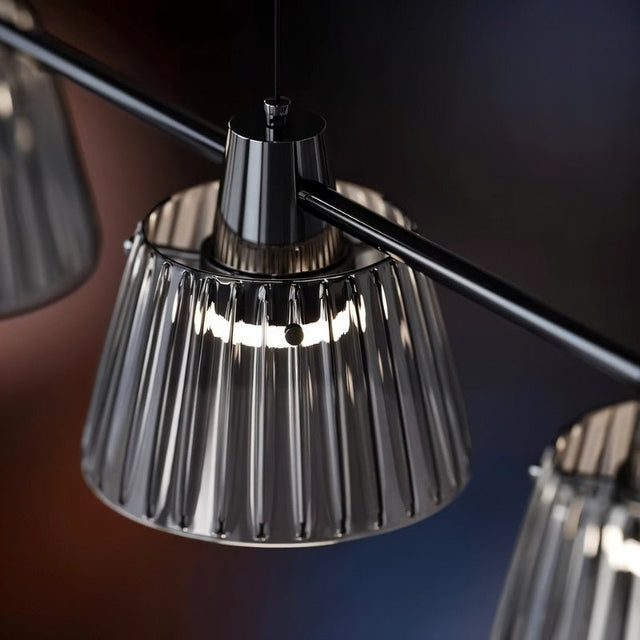 "Close-up of a ribbed glass shade on a modern chandelier, showing its texture and design details."