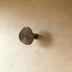 Wooden mushroom-shaped cabinet knob with circular top and cylindrical stem, shown against white background.