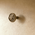 Mushroom-shaped cabinet knob with ribbed dome top and cylindrical stem, polished nickel finish, shown against white backgroun