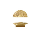 "A gold brass geometric knob with a lattice and sunburst design, isolated on a white background."