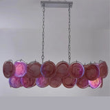 "A modern, rectangular chandelier with cascading pink and iridescent glass discs, illuminated and suspended by chains."