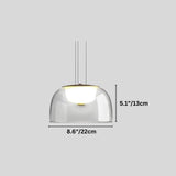 "A modern pendant light with a clear glass dome shade, shown with dimensions of 8.6 inches in width and 5.1 inches in height."