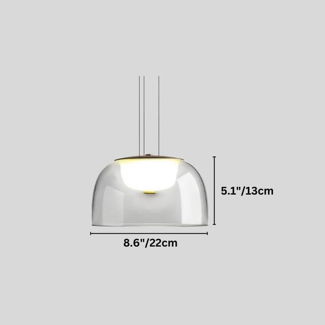 "A modern pendant light with a clear glass dome shade, shown with dimensions of 8.6 inches in width and 5.1 inches in height."