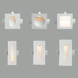 "Set of six white gypsum Onexa trimless wall lights with various cutout shapes and light patterns on a gray background."