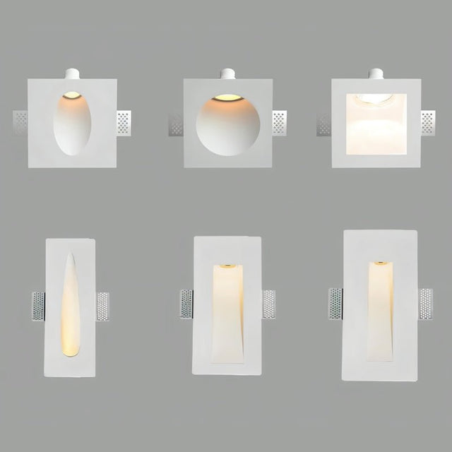 "Set of six white gypsum Onexa trimless wall lights with various cutout shapes and light patterns on a gray background."