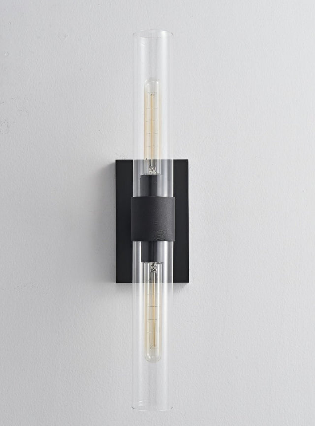 "A modern black wall lamp with a long, vertical cylindrical glass shade, blending vintage and contemporary styles with a sleek, warm glow."