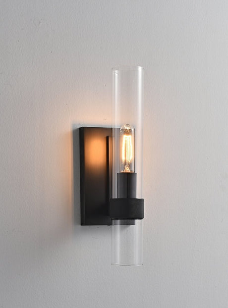 "A modern black wall lamp with a cylindrical glass shade, blending vintage and contemporary styles with a sleek, warm glow."