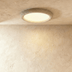 Oval ceiling light fixture with textured white finish, shown from above against white background, 23.6 inches wide by 23.16 i