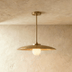 Modern pendant light with wide flat disc shade and exposed bulb, chrome finish, white background, front view.