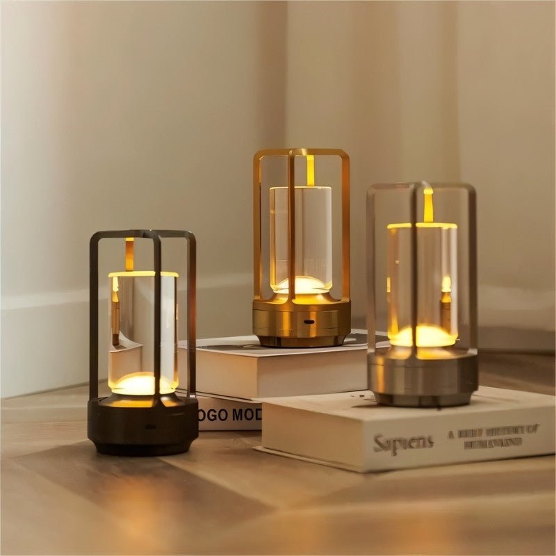 Orena Table Lamp - Sleek Rechargeable Indoor/Outdoor Light in multiple colors, placed on books with soft LED glow for modern interiors.