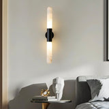 "Modern wall lamp with alabaster shades and a black center, complementing contemporary bedroom decor."