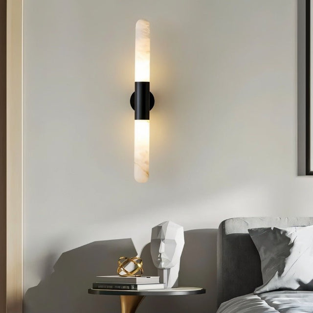 "Modern wall lamp with alabaster shades and a black center, complementing contemporary bedroom decor."