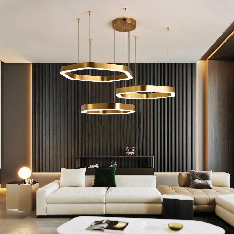 "A modern, gold geometric chandelier enhances the interior design of a contemporary living room."