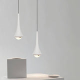 Two white Osvet Pendant Lights suspended in a minimalist setting, showcasing their sleek aluminum design.