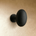 Two ceramic drawer knobs shown side-by-side against white background. Top knob features oval shape, 1.3 inches wide and 0.8 i