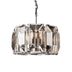Modern crystal chandelier with polished nickel finish and geometric faceted glass panels suspended on chain.