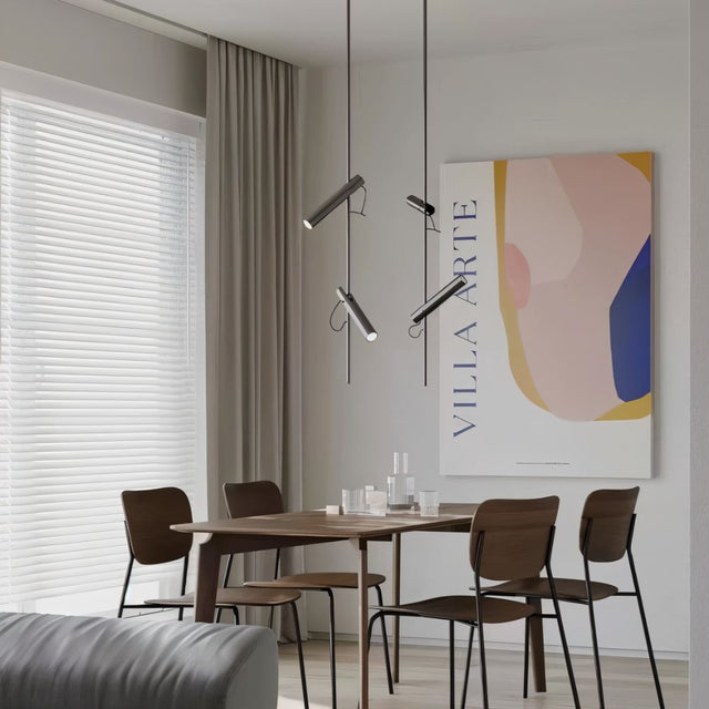 "Modern black stainless steel pendant lights with adjustable tubes above a dining table."