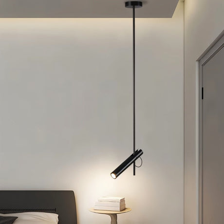 "Stainless steel dual-tube pendant light over a bedside table in a bedroom."