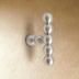 Silver Perla beaded knob with stacked spheres mounted on a cream textured wall